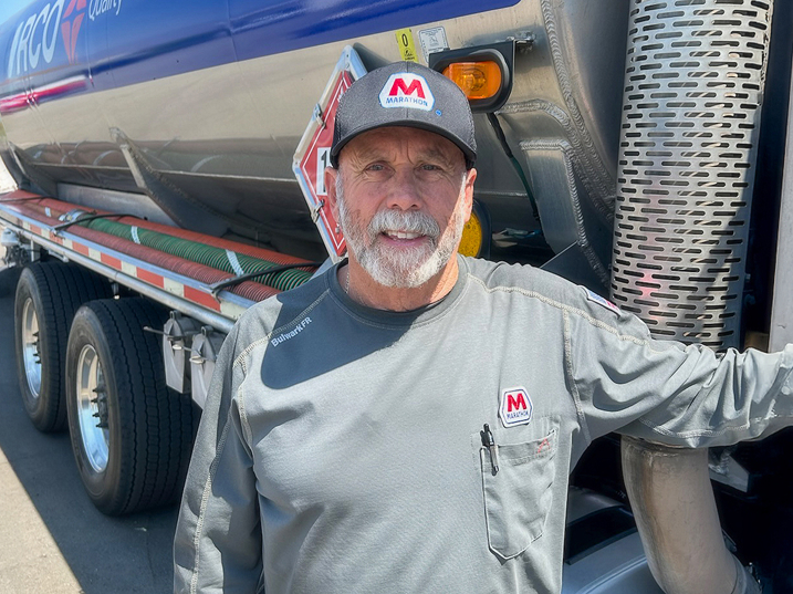 MPC retired driver Joe Finlen posing next to his truck