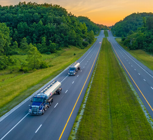 MPC trucks moving down a highway.