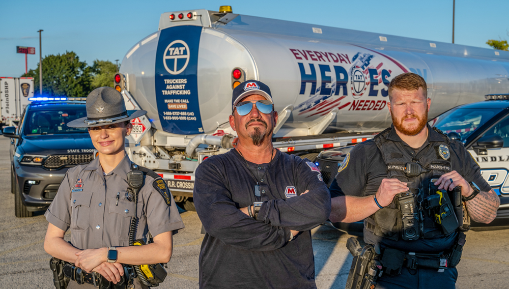Ohio State Highway Patrol Trooper, an MPC driver, Findlay Police Officer pictured in front of an MPC truck